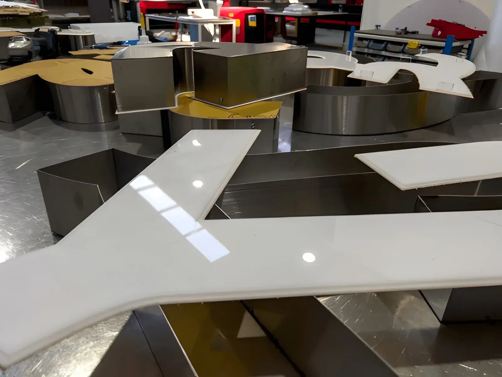 White acrylic faces being assembled with fabricated metal built-up letters — 3D Built-Up Letters example for Edgware HA8