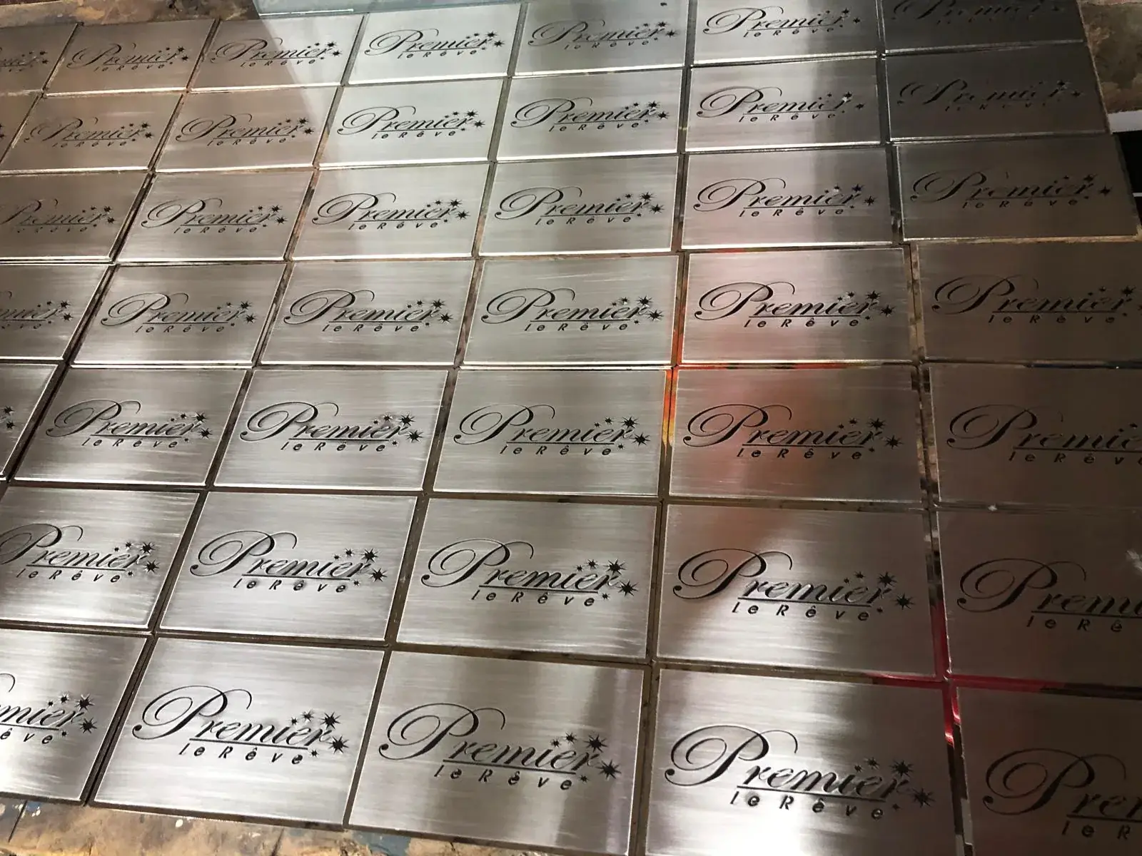 Batch of brushed-metal Premier sign plates prepared in the workshop — 3D Built-Up Letters example for Hackney E8