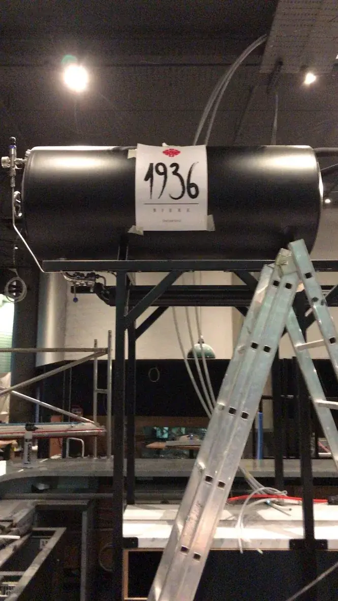 Vertical installation view of black 1936 Bière tank branding, gallery image 22