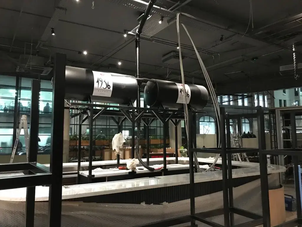 1936 Bière tank branding installation with access equipment beside the support frame, gallery image 23