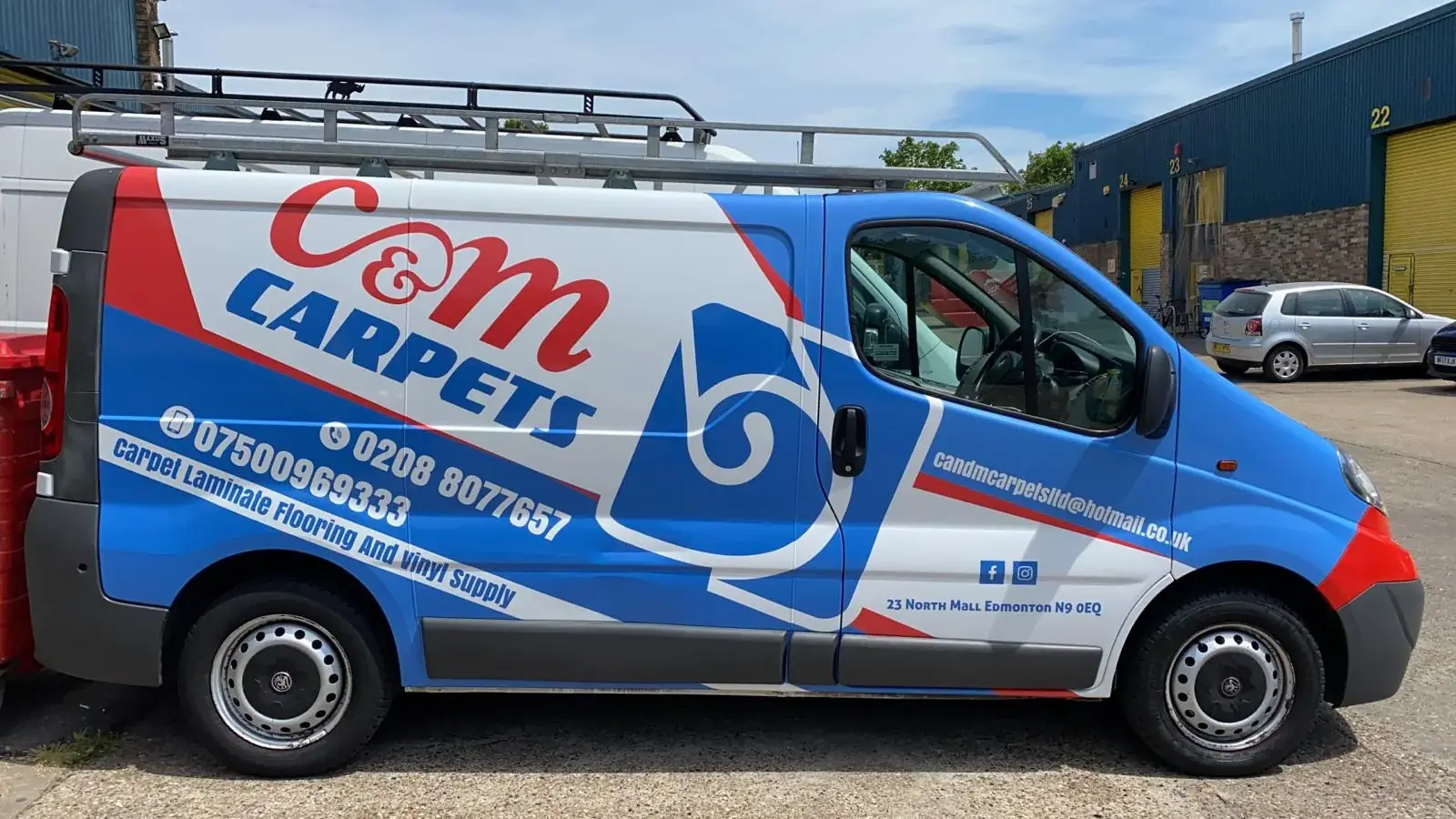 Full side view of the completed C&M Carpets commercial van graphics