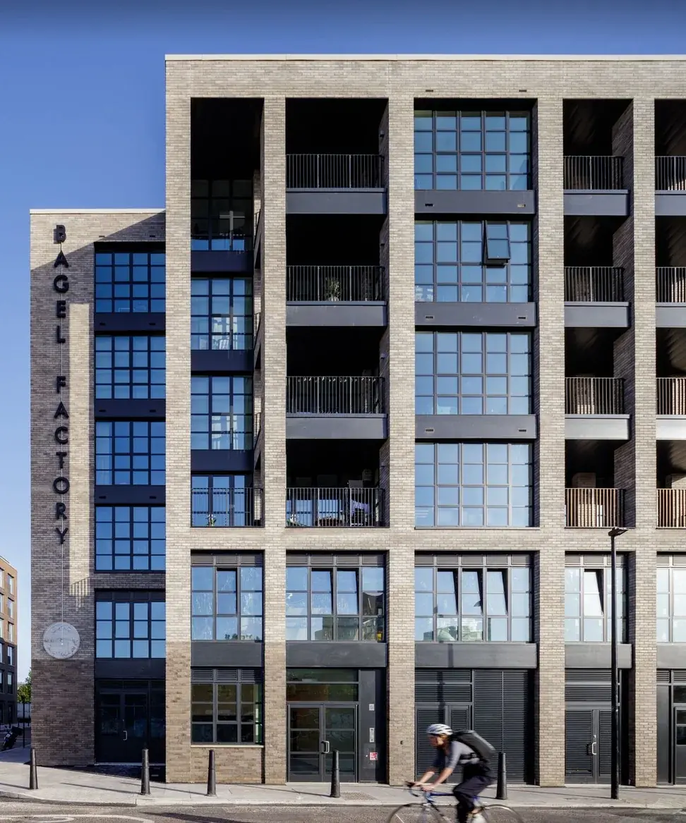 Front elevation of the Bagel Factory building and vertical built-up lettering