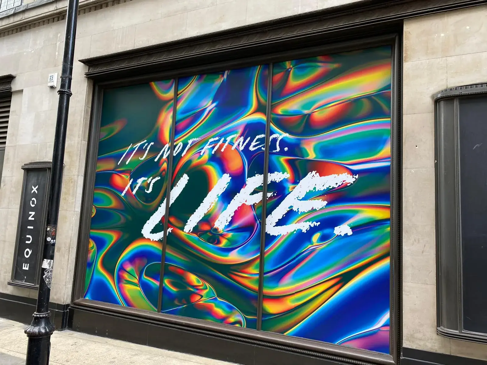Complete street view of the Equinox Kensington campaign window installation