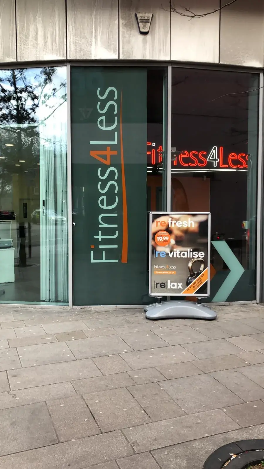 Vertical Fitness4Less window branding and coloured entrance chevrons