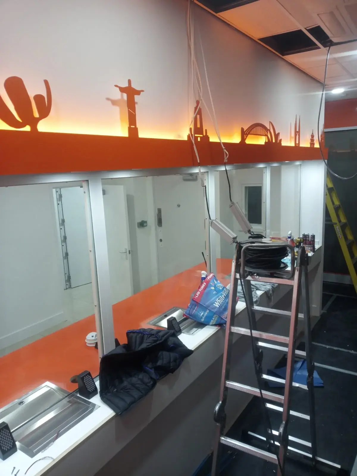 Ria skyline graphics and ceiling lighting during installation