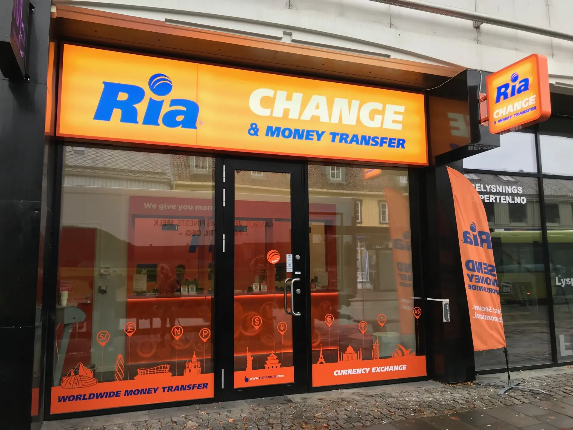 Completed Ria Money Transfer exterior branding across the complete shopfront