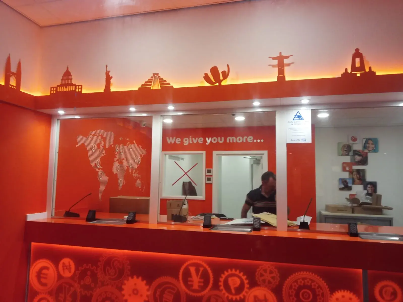 Wide view of the completed Ria Money Transfer interior branding