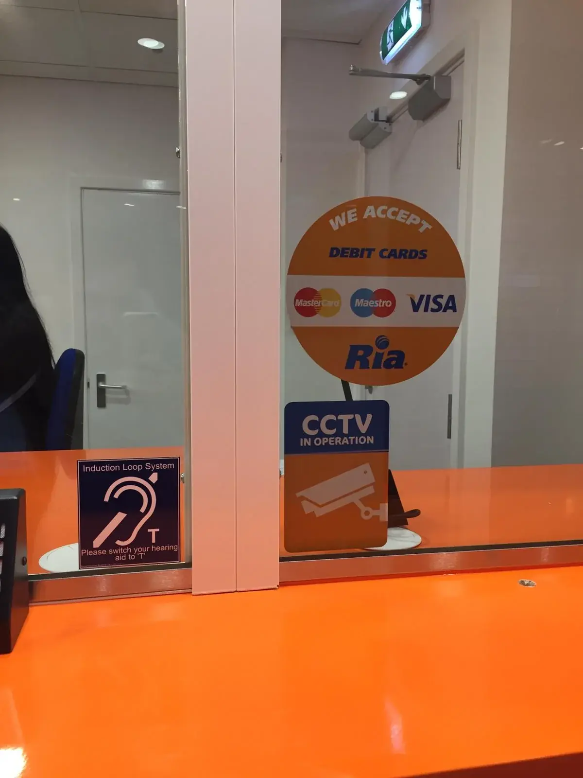 Detailed view of the Ria glass counter screen and orange worktop