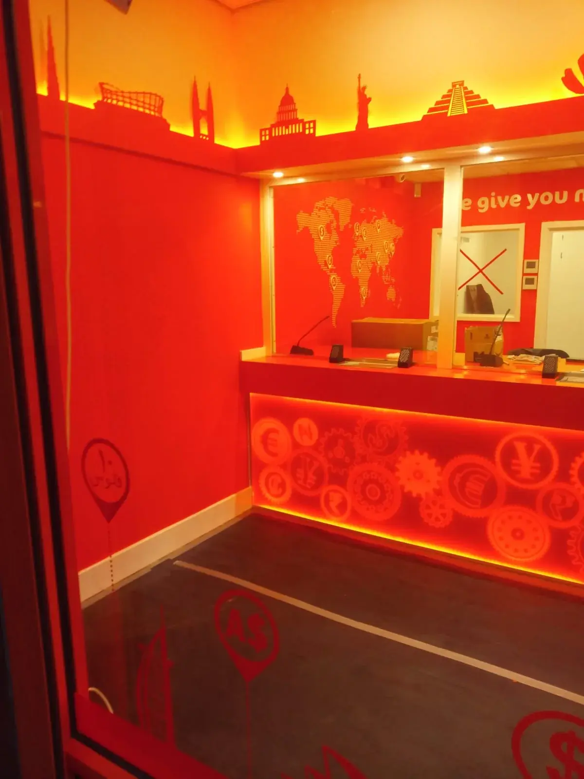 Completed Ria counter with illuminated currency graphics and skyline details