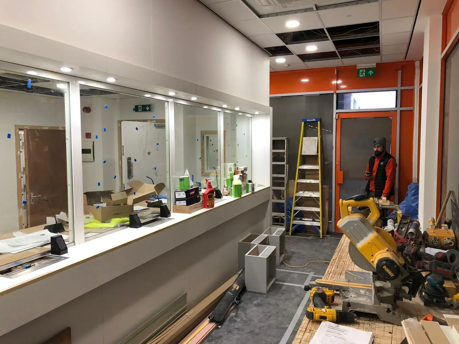 Ria branch interior fit-out in progress around the customer-service counter