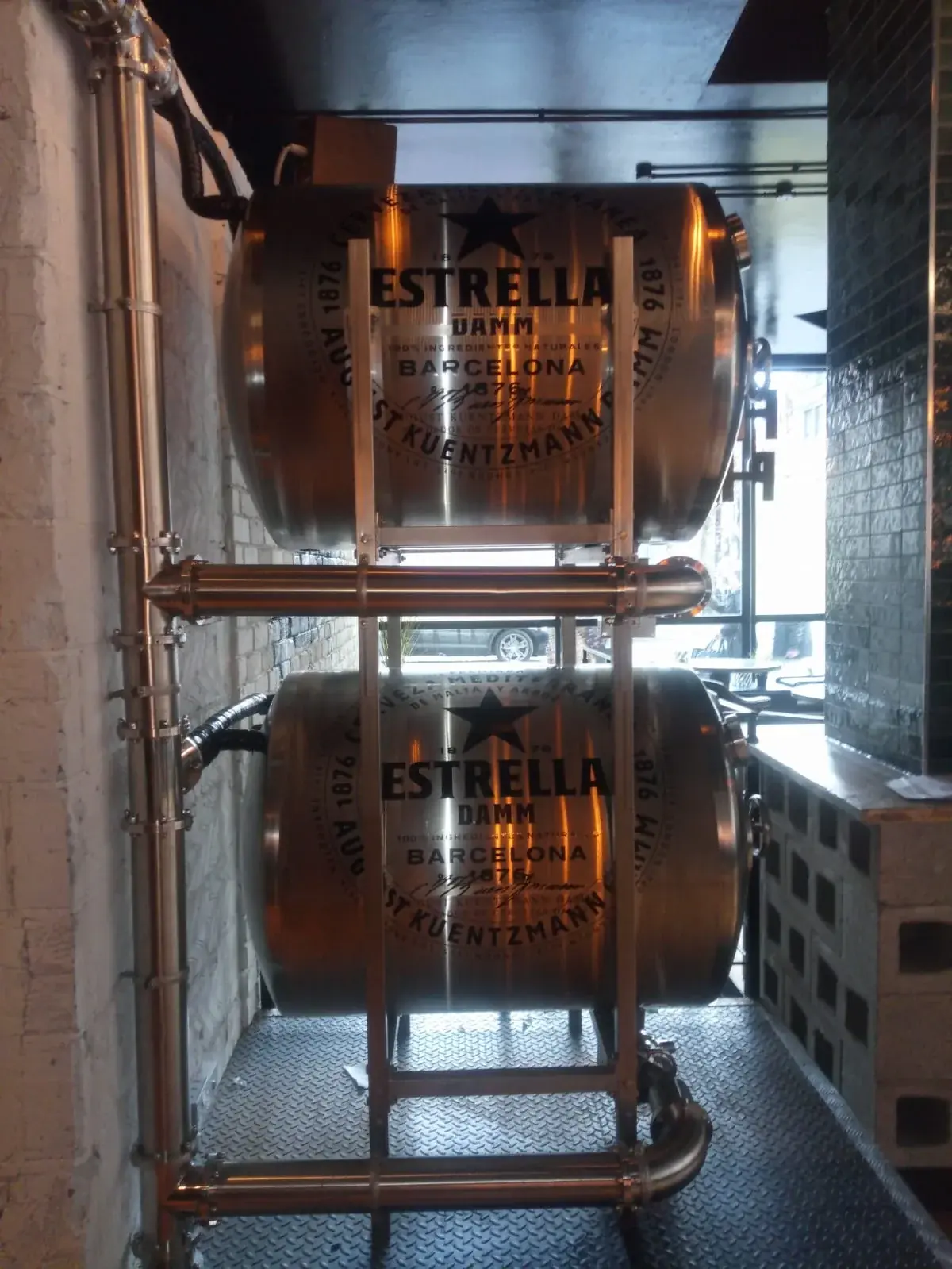 Estrella Damm vinyl stickers fitted to stacked stainless beer tanks, gallery image 5