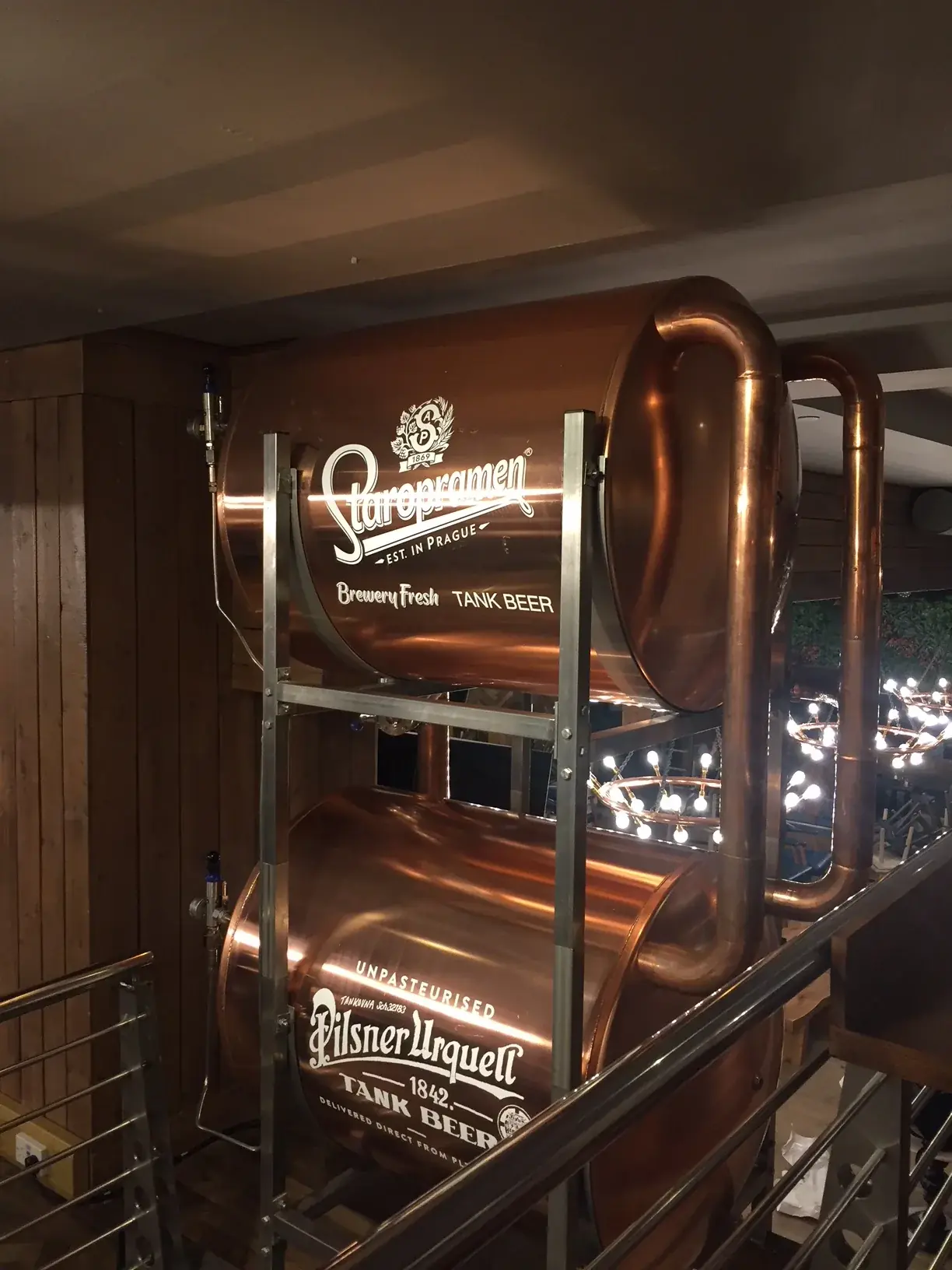 Illuminated Staropramen tank branding in a hospitality venue, gallery image 42