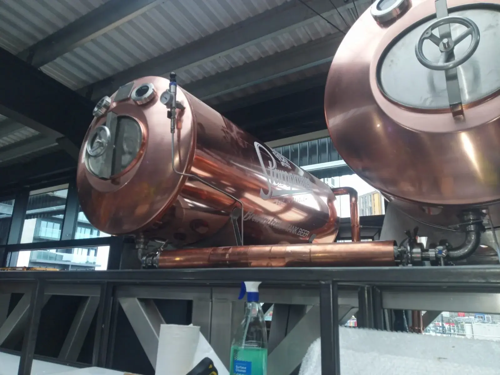 Side view of vinyl graphics installed on copper Staropramen beer tanks, gallery image 7