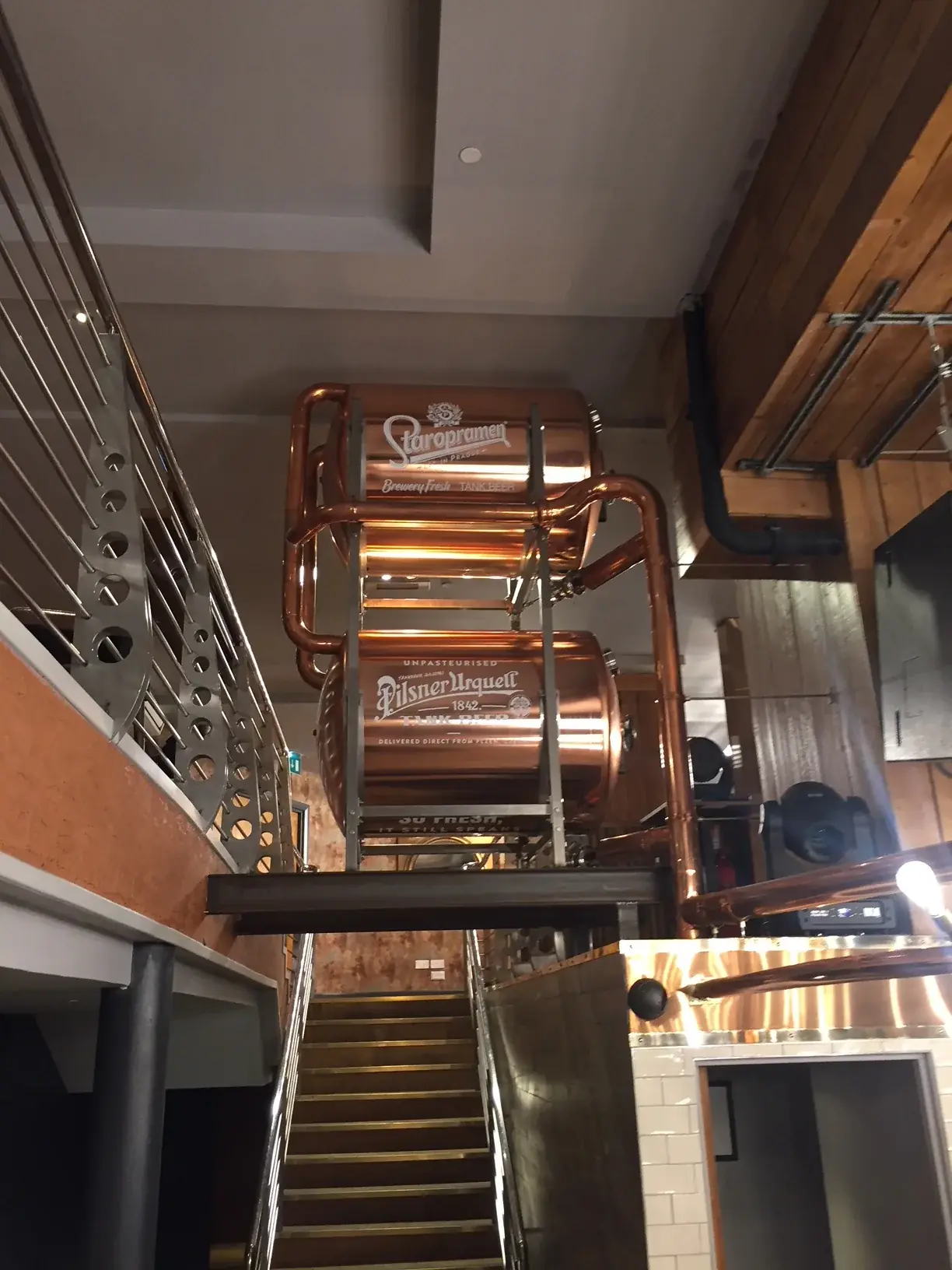 Staropramen copper tank branding installed beside a staircase, gallery image 41