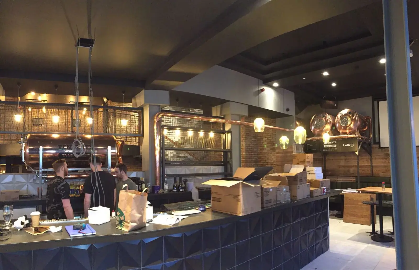 Completed tank beer bar interior with branded tanks and vinyl graphics, gallery image 8