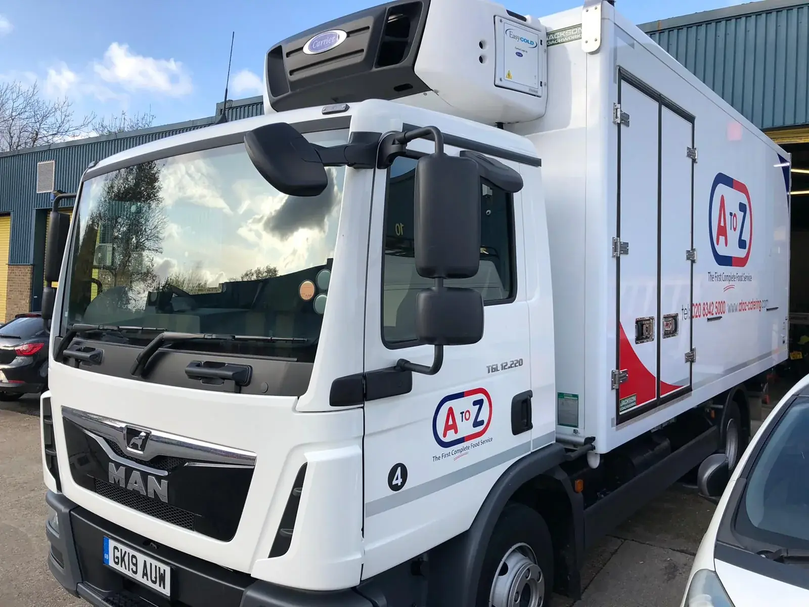 Front-quarter view of the completed A to Z catering truck branding, gallery image 5
