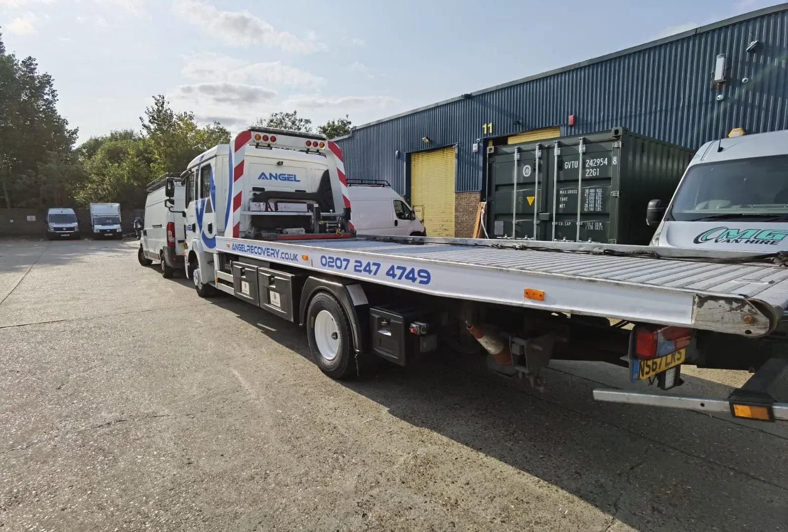 Angel Recovery contact graphics applied along the recovery truck bed — Truck & Lorry Graphics example for Hackney Central E8