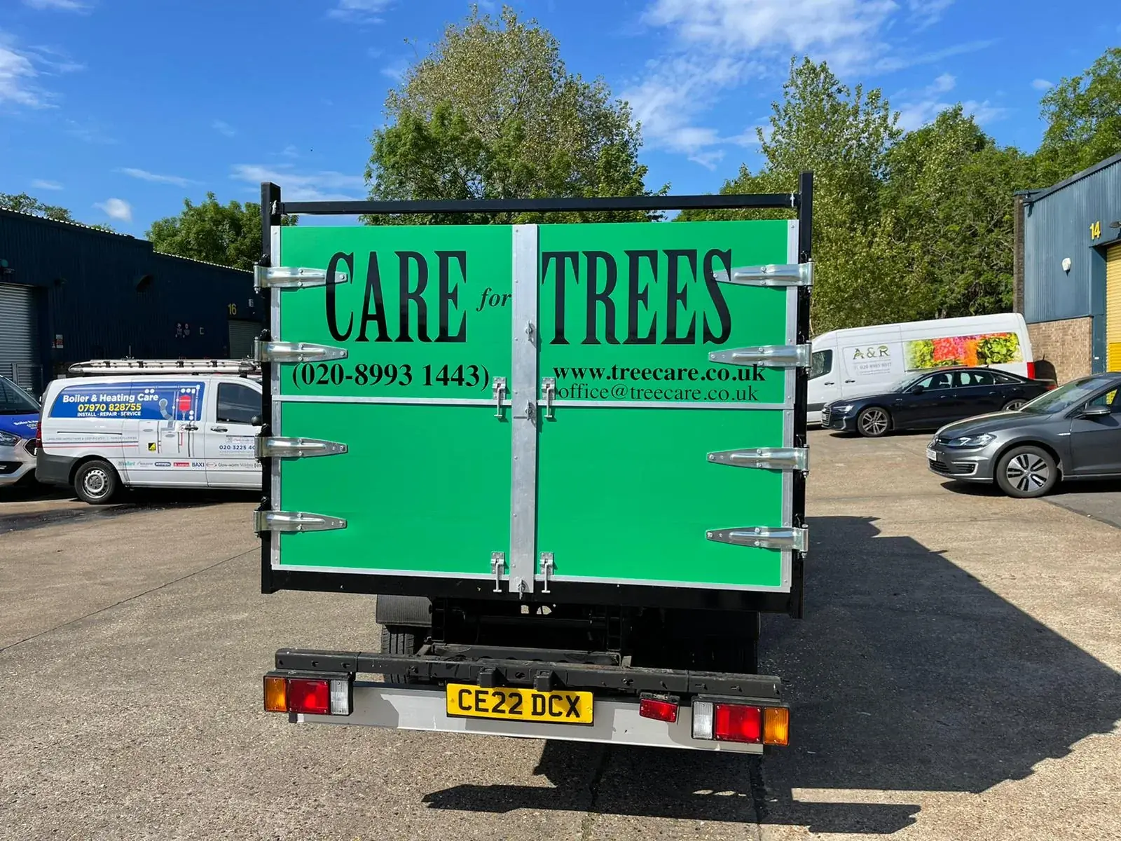 Hackney E8 Truck & Lorry Graphics reference image Treecare truck rear-door graphics with contact details on a green background — Truck & Lorry Graphics example for Hackney E8