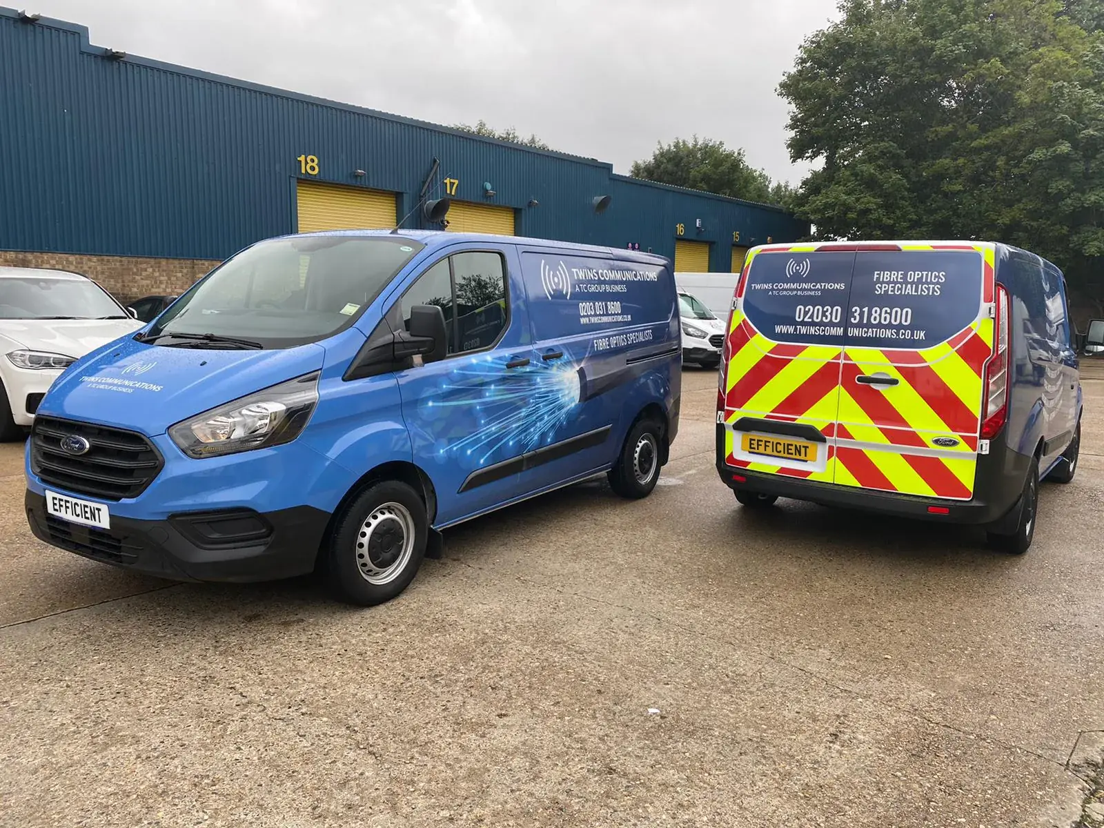 Twins Communications vans with matching blue fibre-optic graphics and rear chevrons — Fleet Graphics example for Holborn WC1/WC2