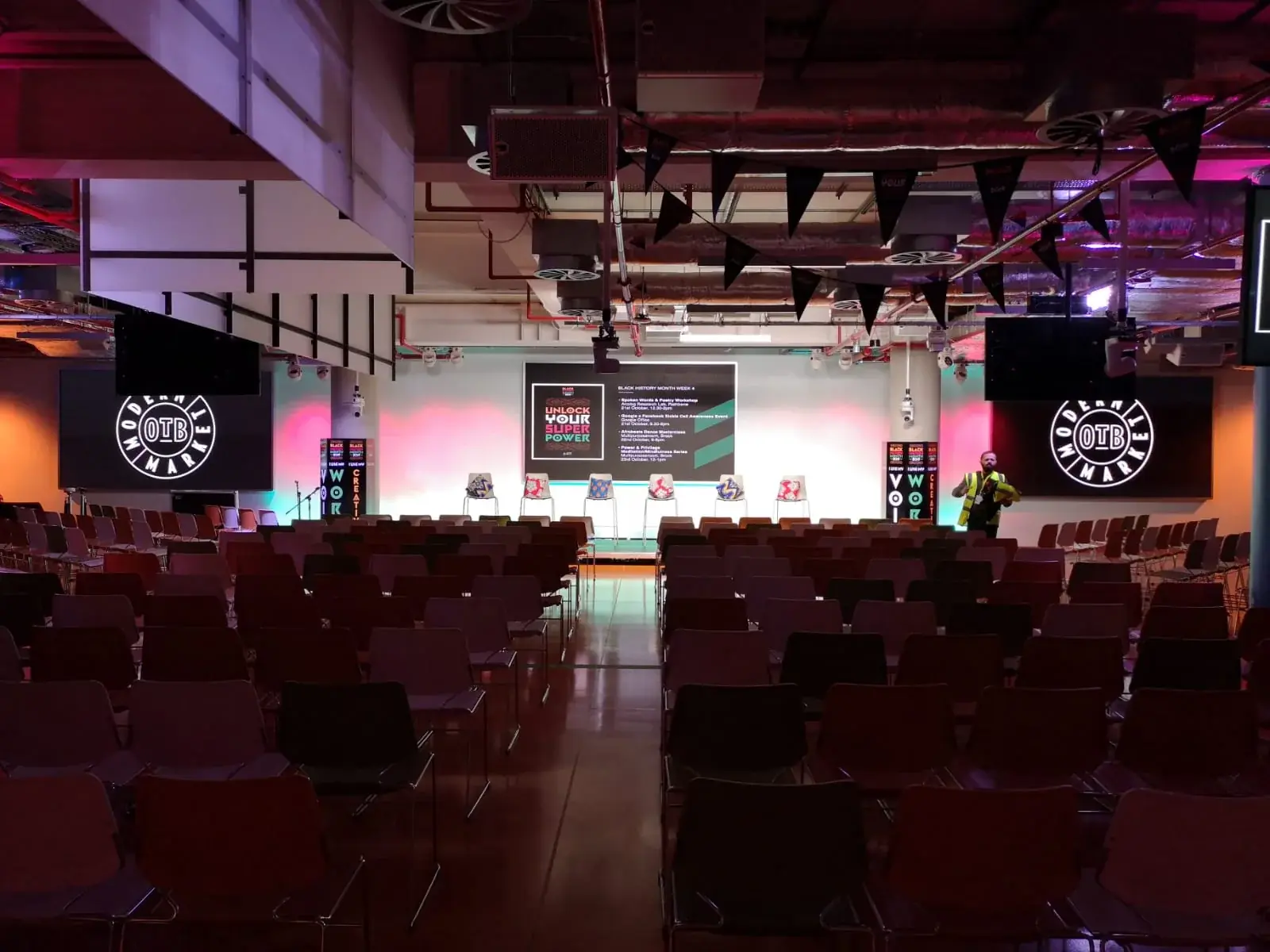 Black History Month stage featuring the Unlock Your Super Power event message