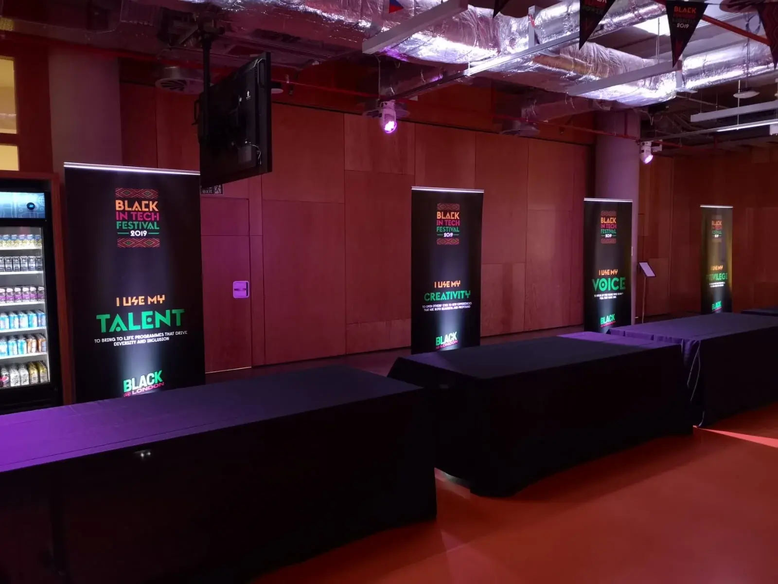 Black in Tech Festival roll-up banners arranged throughout the London event venue